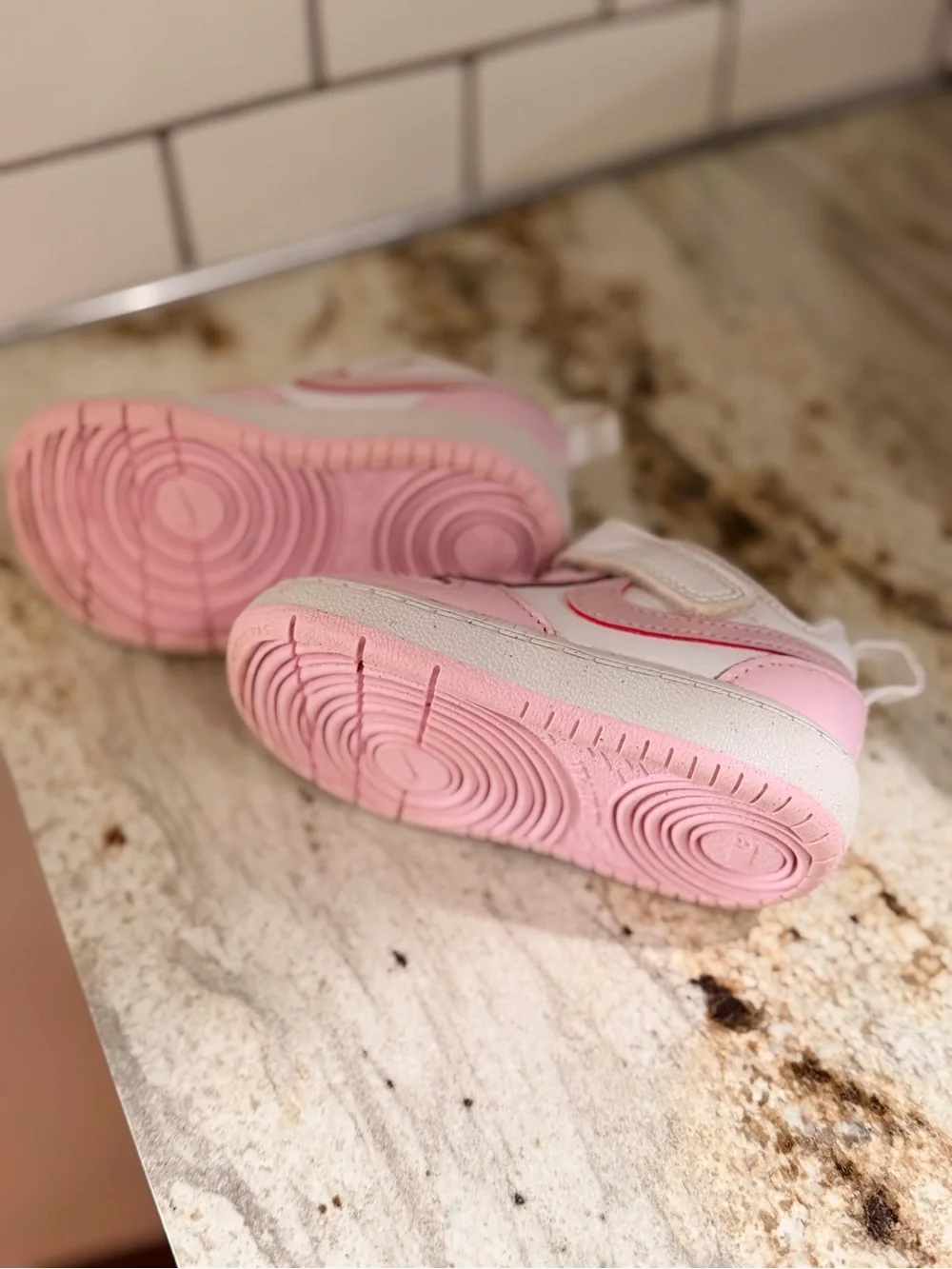 Kids Pink and White Nike shoes